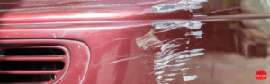 Red car with scratches in an auto body shop - Hovee's Auto Body and Paint - Canoga Park