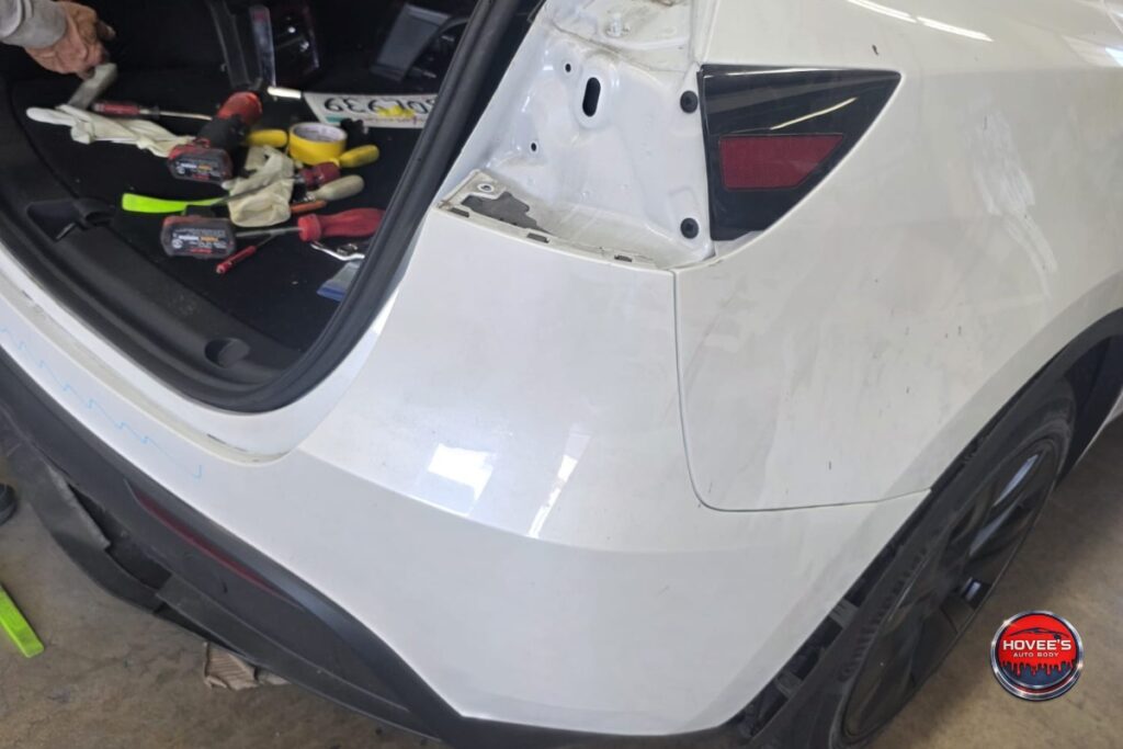 Hovee's technicians replacing the rear body panel on the Tesla Model Y